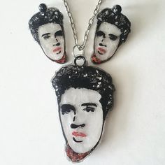 Elvis Presley Necklace, Elvis Earrings, Resin Jewelry, Icon, Resin Art Elvis earrings and necklace are sold separately The necklace and earrings are all handmade and pieces of art. You will receive the exact pieces that are pictured. This is a unique design for Rock My World, Inc. This is an art piece of Elvis.  These pieces are made with layers and layers of resin and fun inclusions. You will never see this anywhere else. It is all handmade and takes hours to create. The necklace and earrings are 3 dimensional. The necklace is a large necklace measuring approximately 3.5inches x 2.25 inches. We then added a silver  loop and then a silver 24 inch chain. The earrings are also layers of resin and you can wear them 2 ways. With matching studs, or stainless steel rings. They measure approximat Priscilla Presley Jewelry, Elvis Presley Rings, Elvis Rings, Elvis Jewelry, Jewelry Icon, Elvis Presley Merch, Earrings Resin, Large Necklace, Earrings And Necklace