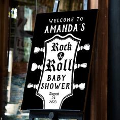 a welcome sign for the rock and roll baby shower