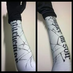 the arm sleeves are decorated with black and white designs