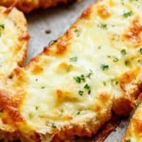 cheesy bread with melted cheese and parsley