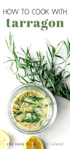 an overhead view of a bowl of tarrag with lemons and herbs on the side