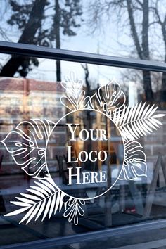 a window with the words your logo here etched into it