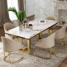 a marble dining table surrounded by beige chairs and a plant in a vase on top