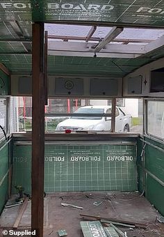 the inside of an old building that has been torn down and is being renovated with green tiles