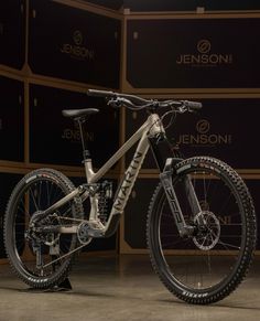 a bike is shown in front of a wall with the name jeson on it