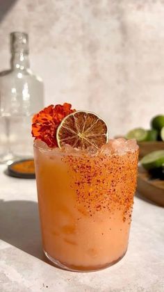 a drink with orange garnish on the rim