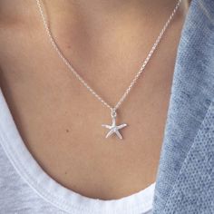 Starfish Pendant Necklace in Sterling Silver, beautifully crafted, designed and created in Cornwall with intricate detailing on both front and back. Made from Sterling silver, the Starfish is approx. 15mm. and hangs on a Sterling Silver diamond cut Rolo chain (Choose your necklace length from the drop-down menu). Very dainty, it makes a cute gift. Treat yourself, or if you would like to gift it to a special someone else there is a ribboned gift box available, just select from the drop-down menu. Processing time is one to two days. I will send your parcel using Royal Mail, this is an economy standard service. If you would like your item tracked or have it sent quickly, then please select the service you require at checkout. I personally source and assemble all my Jewellery Pieces with love,