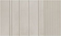 a white wall with vertical lines painted on it