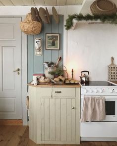 a kitchen with an oven, stove and pictures on the wall above it that says good morning