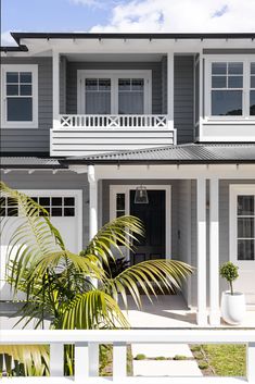 a house with white trim and blue siding