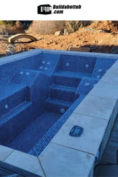 an empty swimming pool in the middle of a construction project with blue grates on it