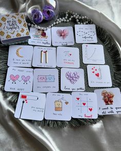 playing cards are laid out on a tray with beads and other items around them,