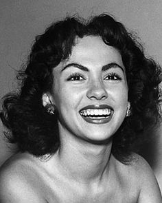 black and white photograph of a woman smiling