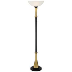 a floor lamp with a white glass shade on the top and a black metal base