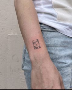 a person with a small tattoo on their arm