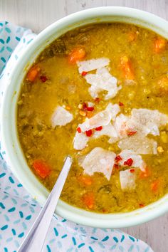 a white bowl filled with soup on top of a table