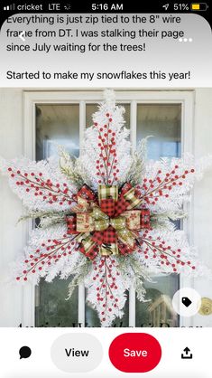 a snowflake wreath on the front door of a house that says, started to make my snowflakes this year