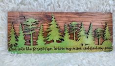 a wooden sign that says and into the forest i go to lose my mind and find my soul