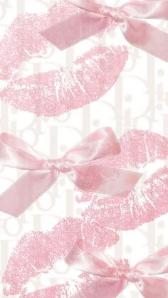 pink lips and bows on white background with words written in the bottom right hand corner