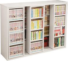 a white bookcase filled with lots of books