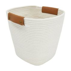 a large white basket with leather handles