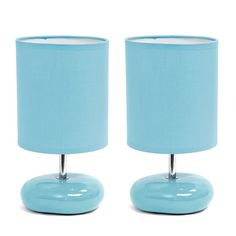 two blue lamps sitting next to each other