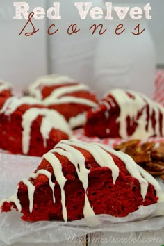 red velvet bundt cake with white icing drizzled on top and one slice missing