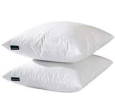 two pillows sitting side by side on top of each other