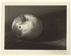 an apple sitting on top of a wooden table