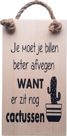 a wooden sign that says, je motet je billen better afegen want er zit nog cactus