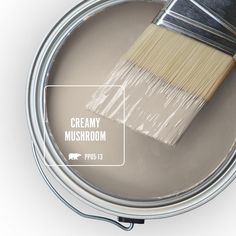 a paint can with a brush in it and the words adde sand on top