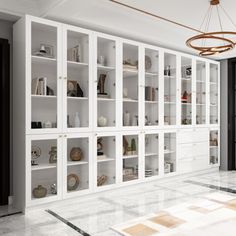 a large white bookcase in the middle of a room with marble floors and walls