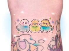 a woman's leg with tattoos on it and three small birds in the middle