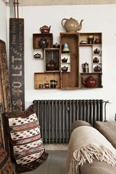 a living room filled with furniture next to a radiator