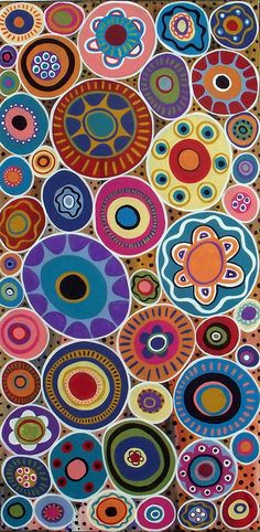 a colorful rug with circles and flowers on the side, in multicolored colors