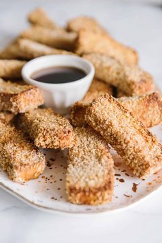 fried chicken sticks and dipping sauce on a plate