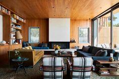 a living room filled with furniture and bookshelves