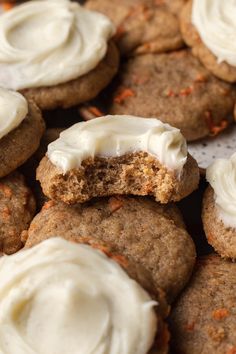 cookies with white frosting and carrots on top