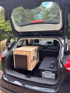 the back end of a car with its trunk open