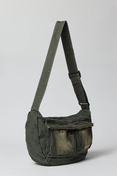 Acid wash crossbody bag by UO's own BDG label. Durable cotton canvas bag with zippered pockets and an adjustable webbing shoulder strap. Urban Outfitters exclusive. Features Crossbody bag from BDG Acid wash cotton canvas Utility style pockets Adjustable webbing strap UO exclusive Content + Care 100% Cotton Spot clean Imported | BDG Acid Wash Crossbody Bag in Olive, Men's at Urban Outfitters Men Bag Aesthetic, Aesthetic Crossbody Bag, Men’s Bags, Cross Body Bag Men, Gifts For Young Men, Men Crossbody Bag, Vintage Canvas Bags, Crossbody Bag Men, Shoulder Bags Outfit