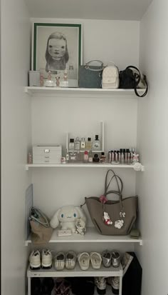 a white shelf filled with lots of personal items