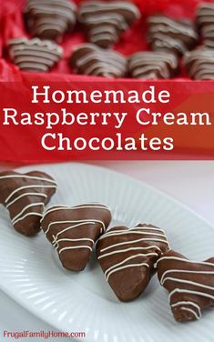 homemade raspberry cream chocolates on a white plate with a red box in the background