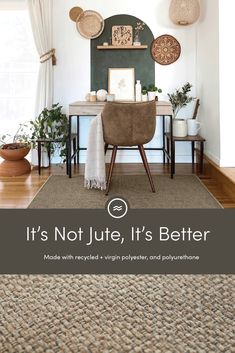 a living room with a rug, chair and desk in front of a wall that says it's not just life, it's better