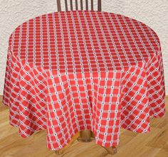 a red and white checkered tablecloth on a wooden chair