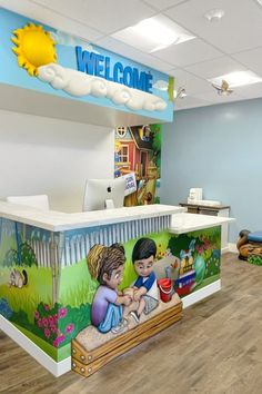 the front desk of a children's hospital with an image of a child on it