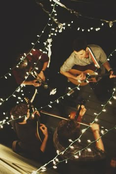 a group of people standing around each other with lights on them and the words music tips above them