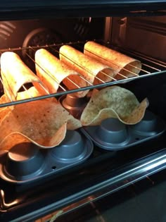 some tortilla shells are in an oven