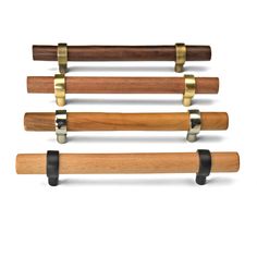 four different types of wooden handles on white background