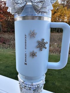 a cup that has some snowflakes on it