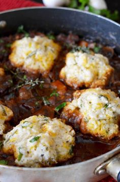 some food is cooking in a pan on the table